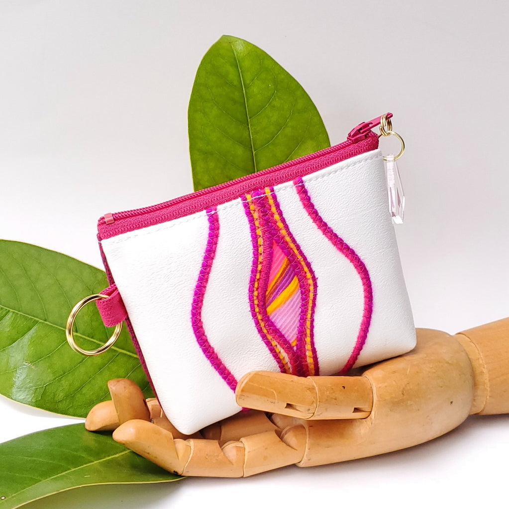 Sacred Fruit Pink embroidery on white Vagina Vulva Wallet by Anne Marie Beard. Handmade in Austin, Texas since 2002 y'all! annemarie mini wallet austin texas