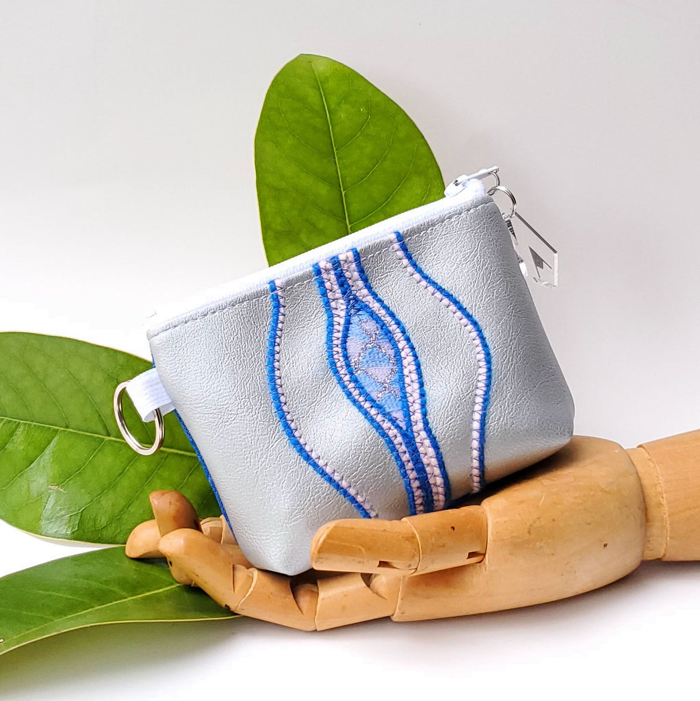 Sacred Fruit Silver with Blue Embroidered Vagina Vulva Wallet by Anne Marie Beard. Handmade in Austin, Texas since 2002 y'all! annemarie mini wallet austin texas