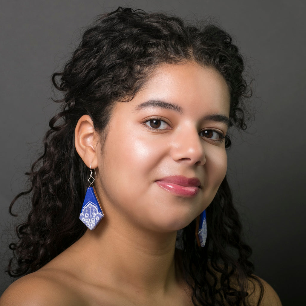 Cobalt blue textile earrings sustainably made in Austin Texas by designer Anne Marie Beard. Model Melina Perez. Photographer Rachel Boettcher.