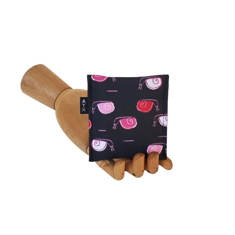 Pink and Red snails partying on a black background. Velcro Mini Wallet by Anne Marie Beard. Handmade in Austin, Texas since 2004 y'all! annemarie mini wallet austin texas snail snails cute creatures