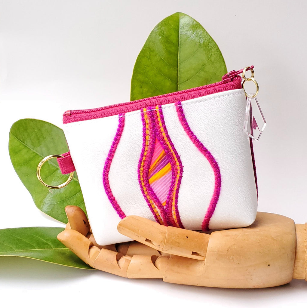 Sacred Fruit Pink embroidery on white Vagina Vulva Wallet by Anne Marie Beard. Handmade in Austin, Texas since 2002 y'all! annemarie mini wallet austin texas