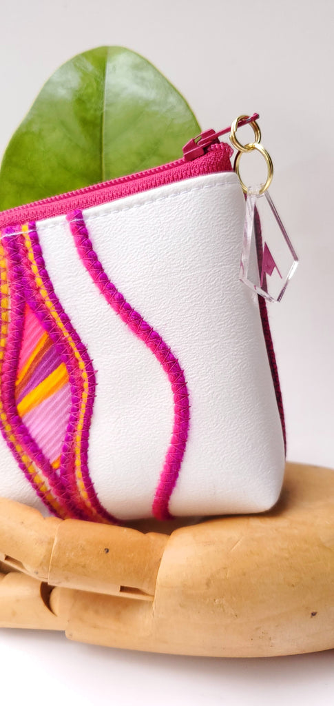 Sacred Fruit Pink embroidery on white Vagina Vulva Wallet by Anne Marie Beard. Handmade in Austin, Texas since 2002 y'all! annemarie mini wallet austin texas